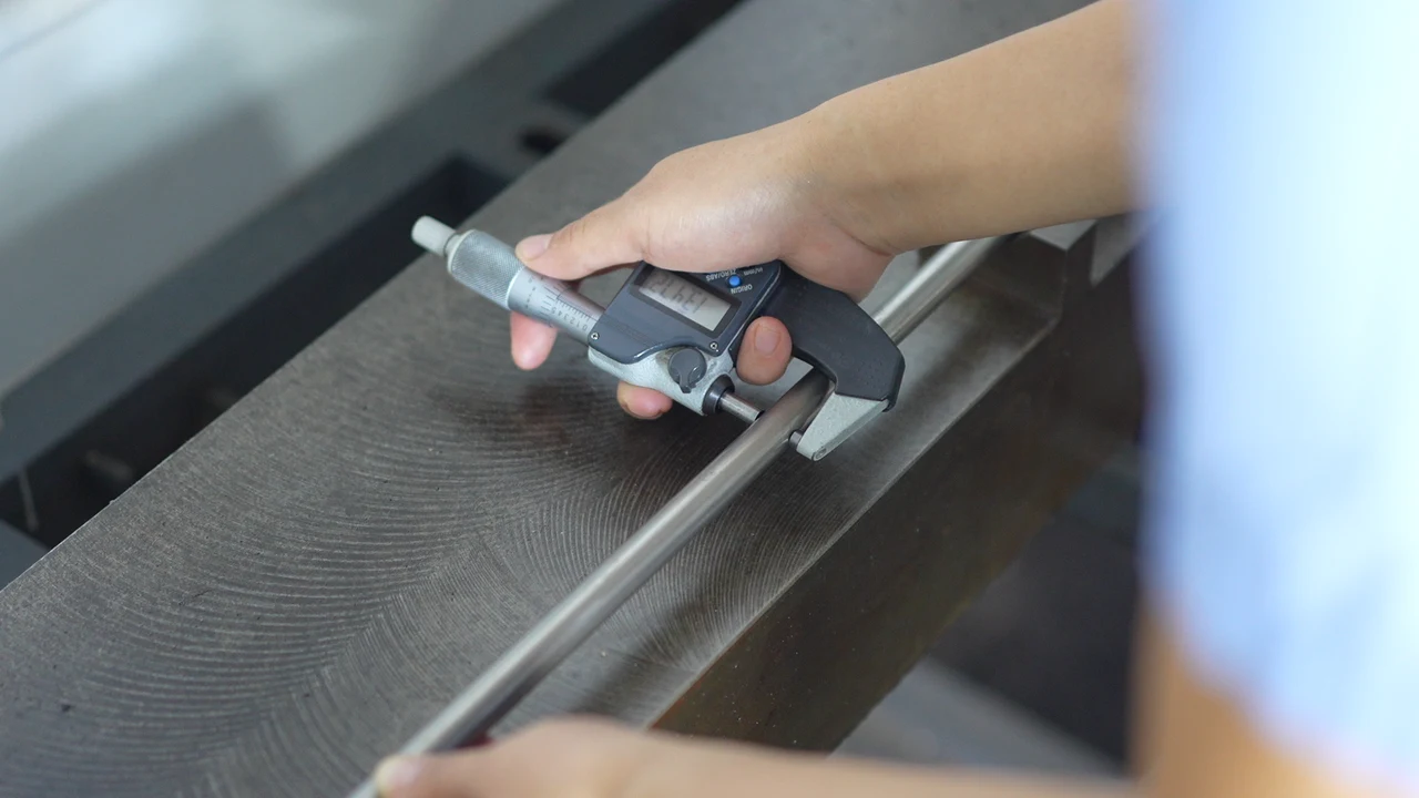 Vernier caliper measurement of metal stock
